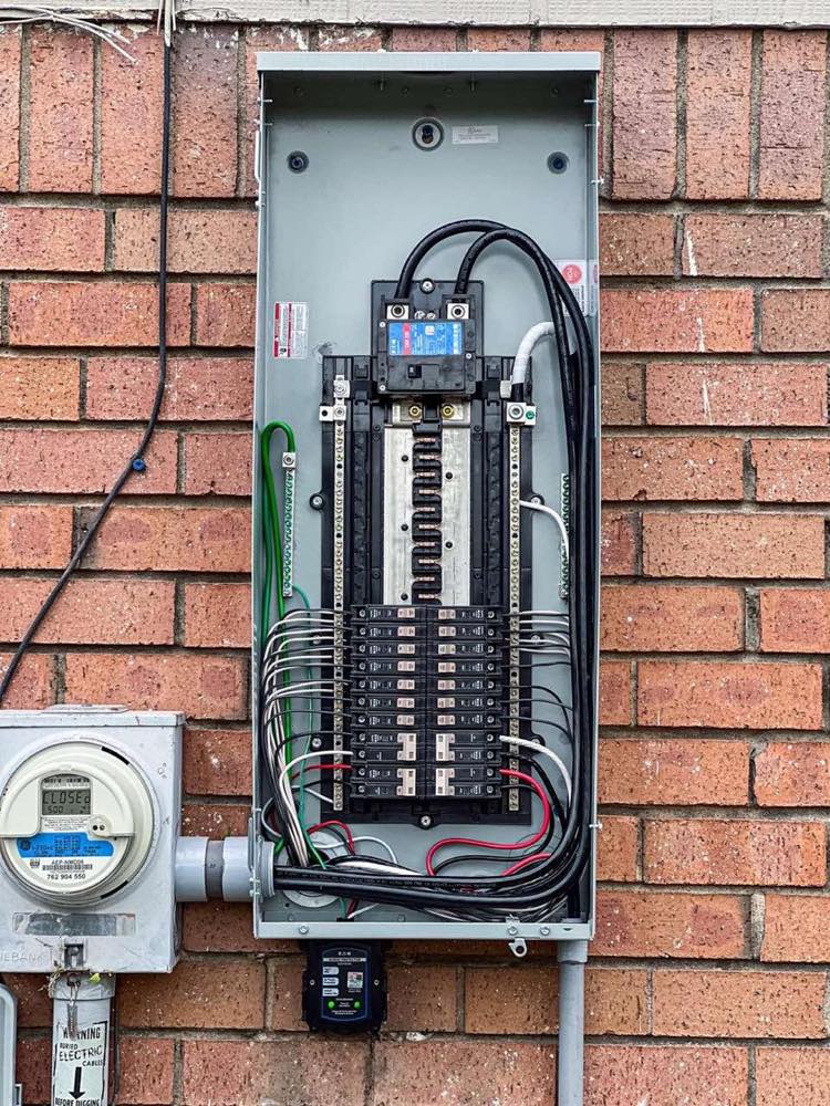 200-amp electrical panel upgrade installed by Epic Electric on a brick home in the Tulsa metro